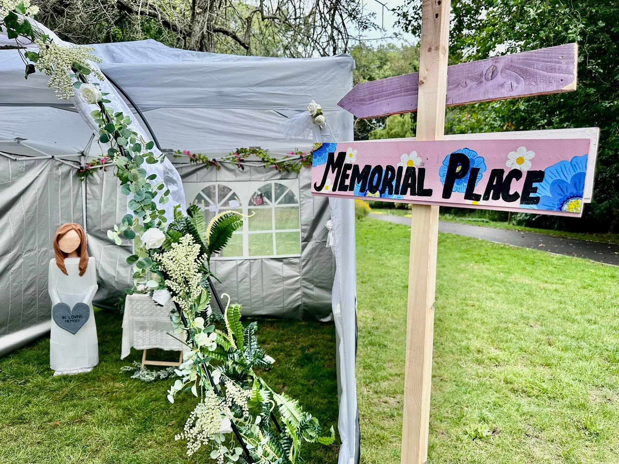 Sign pointing towards memorial place at SALT Festival